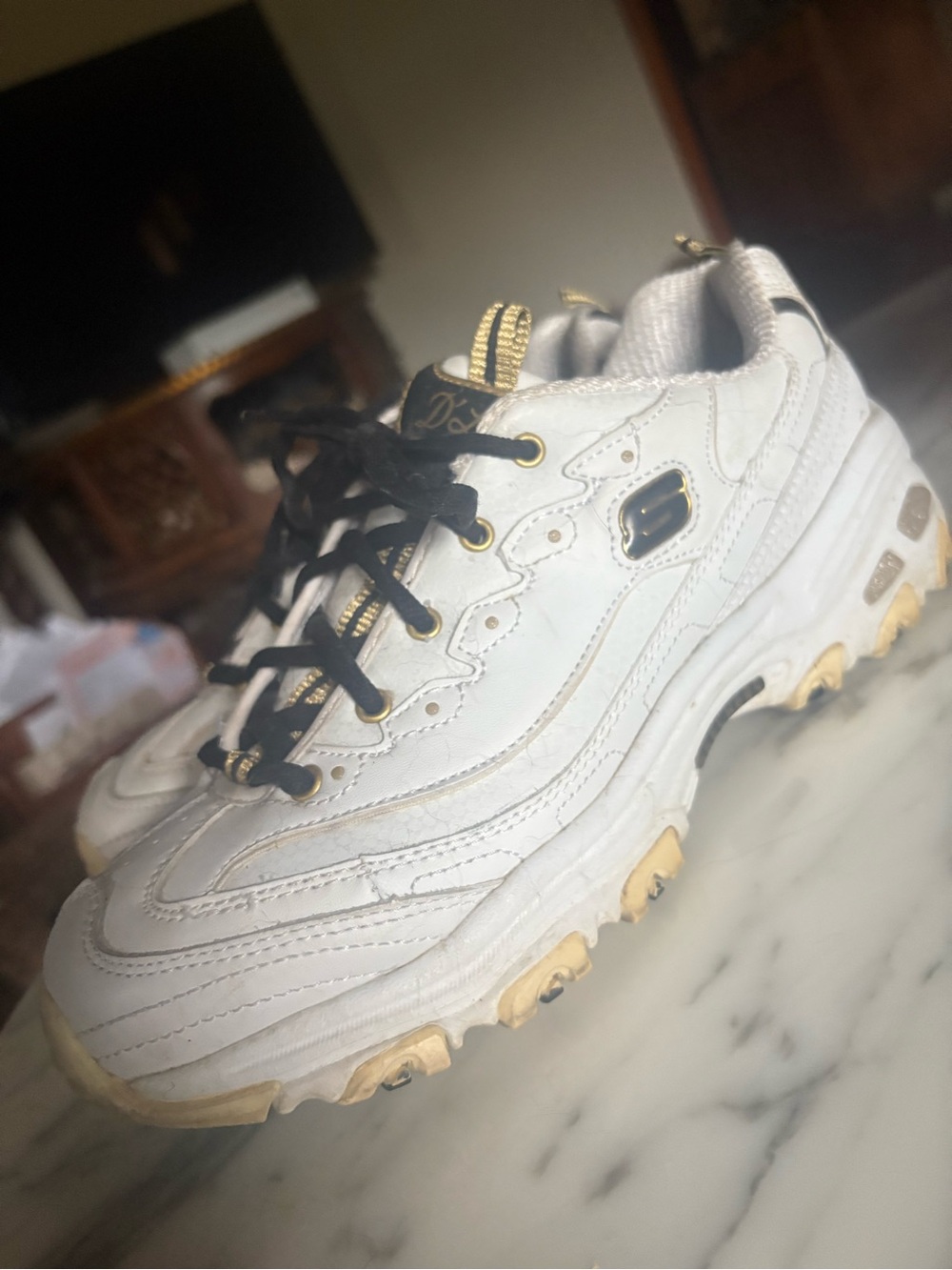 Women’s Skechers D'Lites White Athletic Sneakers with Black & Gold Trim